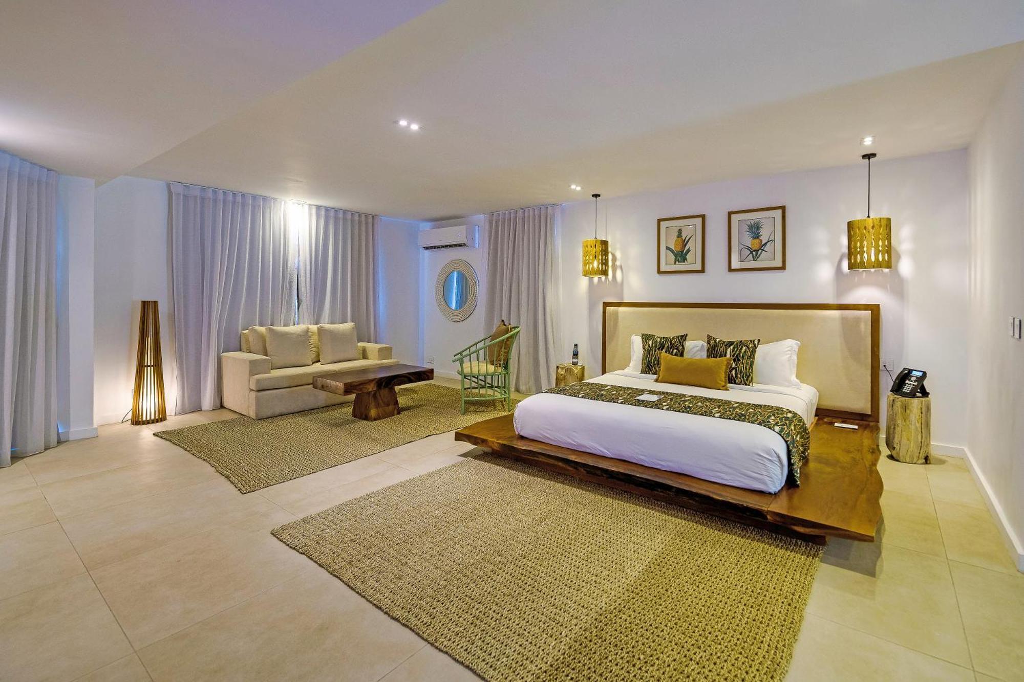 Seasense Boutique Hotel & Spa (Adults Only) Belle Mare Kültér fotó A bedroom at the resort